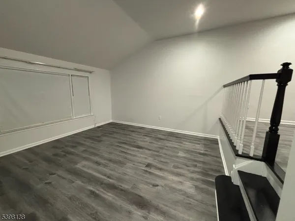 a view of wooden floor in an empty room
