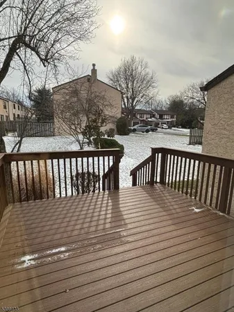 a balcony with view of wooden floor