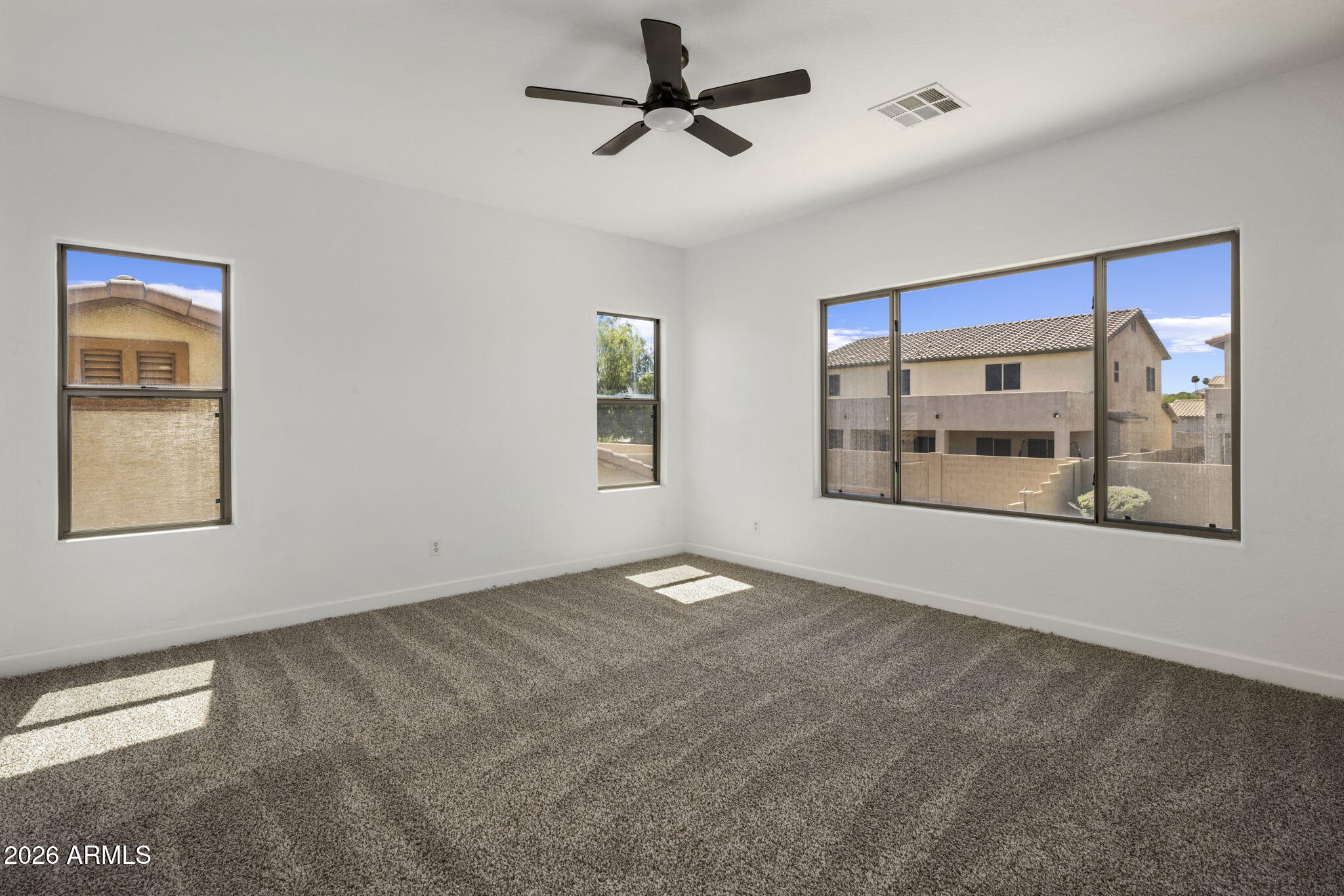 5121 West Beverly Road Laveen, AZ 85339 - Photo 30 of 32 a view of an empty room with a window