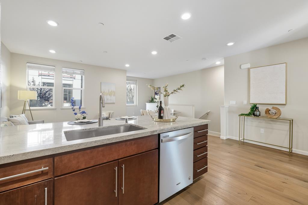 1036 Onofrio Lane, Unit 6 San Jose, CA 95133 - Photo 15 of 50 a kitchen with sink stove and cabinets