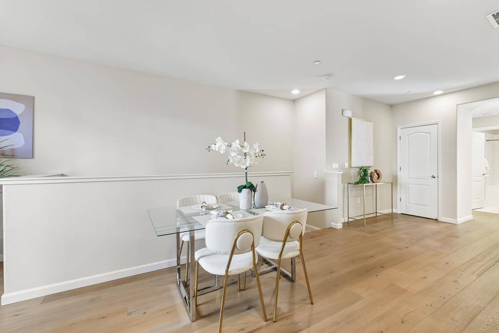 1036 Onofrio Lane, Unit 6 San Jose, CA 95133 - Photo 23 of 50 a dining room with furniture and chandelier