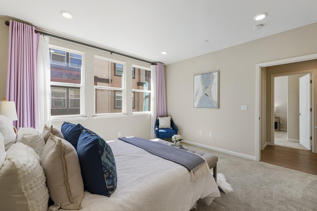 1036 Onofrio Lane, Unit 6 San Jose, CA 95133 - Photo 25 of 50 a bedroom with a bed and a large window
