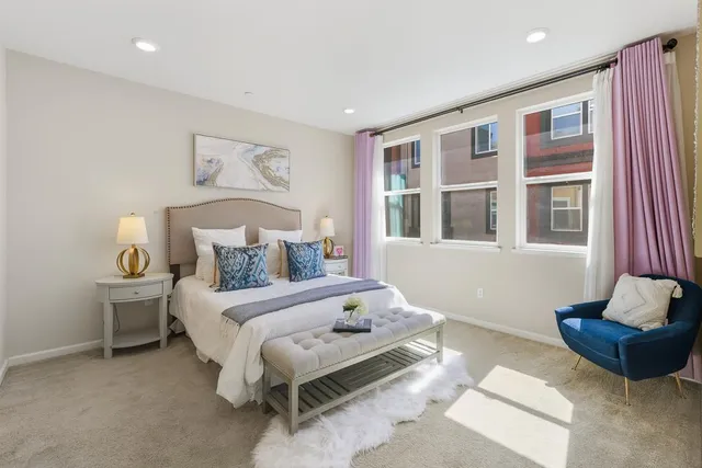 a bedroom with a bed and a couch