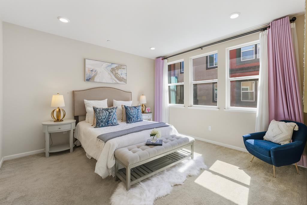 1036 Onofrio Lane, Unit 6 San Jose, CA 95133 - Photo 26 of 50 a bedroom with a bed and a couch