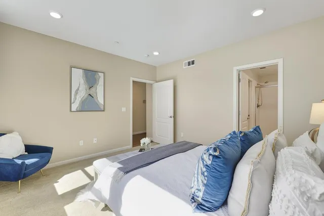 a bed room with a bed and a couch