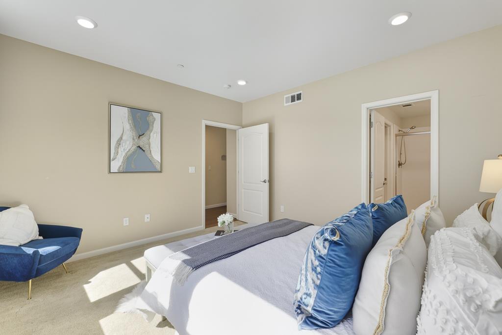 1036 Onofrio Lane, Unit 6 San Jose, CA 95133 - Photo 27 of 50 a bed room with a bed and a couch
