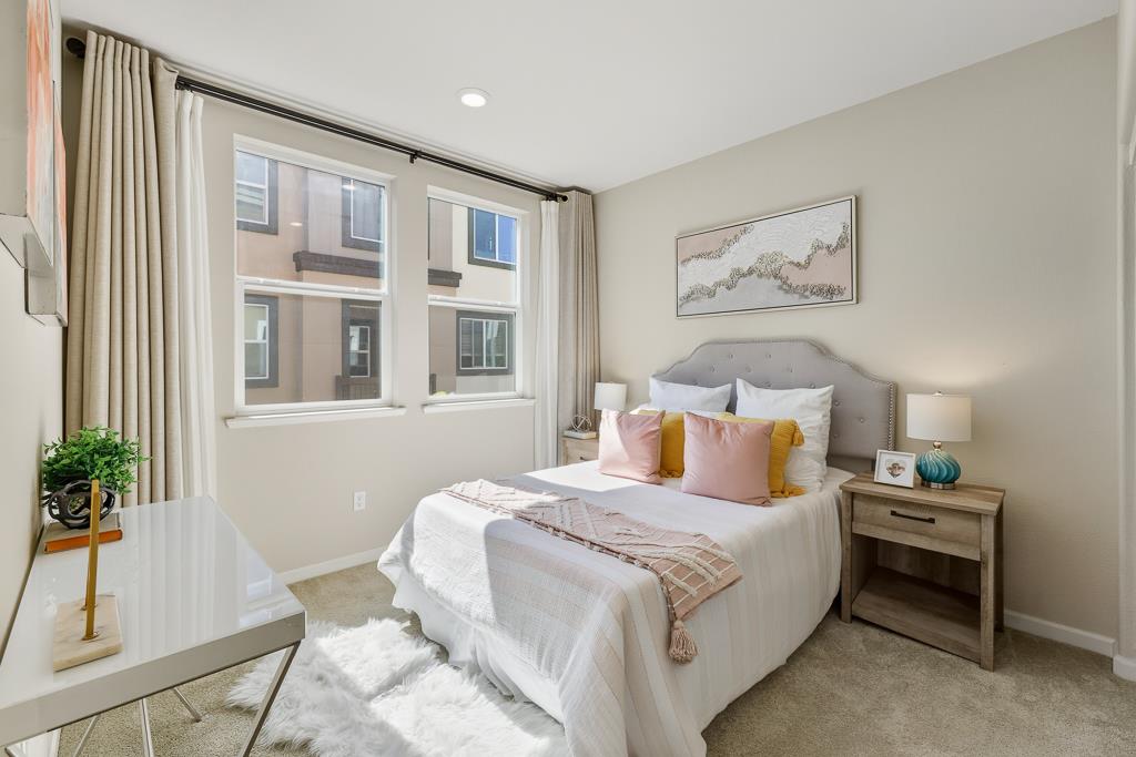 1036 Onofrio Lane, Unit 6 San Jose, CA 95133 - Photo 28 of 50 a bedroom with a bed and a potted plant next to a window