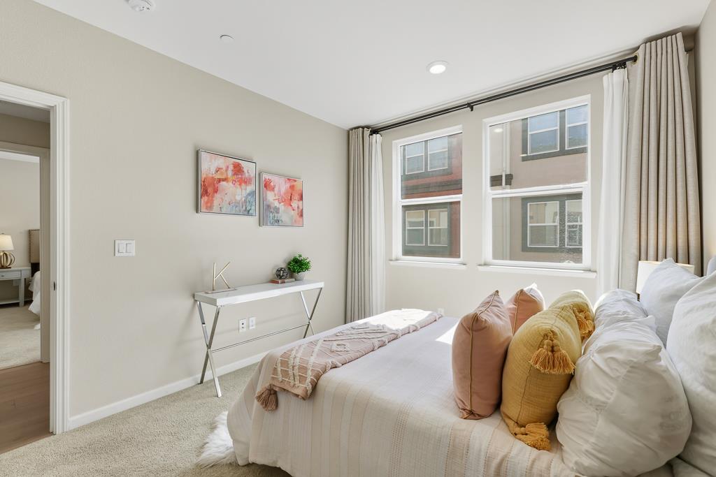 1036 Onofrio Lane, Unit 6 San Jose, CA 95133 - Photo 29 of 50 a bed sitting in a bedroom next to a window