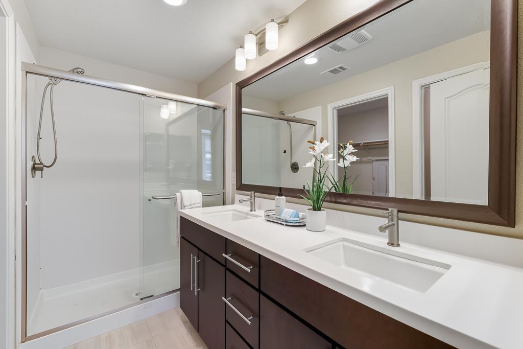 1036 Onofrio Lane, Unit 6 San Jose, CA 95133 - Photo 32 of 50 a bathroom with a sink and a mirror