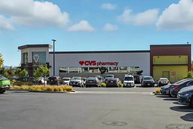 a view of a cars park in front of a house