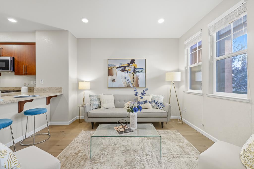 1036 Onofrio Lane, Unit 6 San Jose, CA 95133 - Photo 8 of 50 a living room with furniture and wooden floor