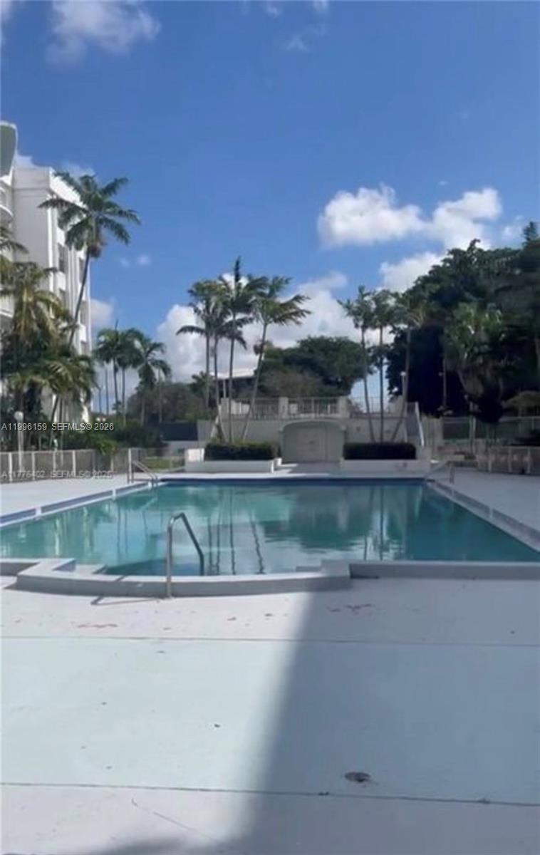 496 Northwest 165th Street, Unit D611 Miami, FL 33169 - Photo 1 of 8 a view of a lake