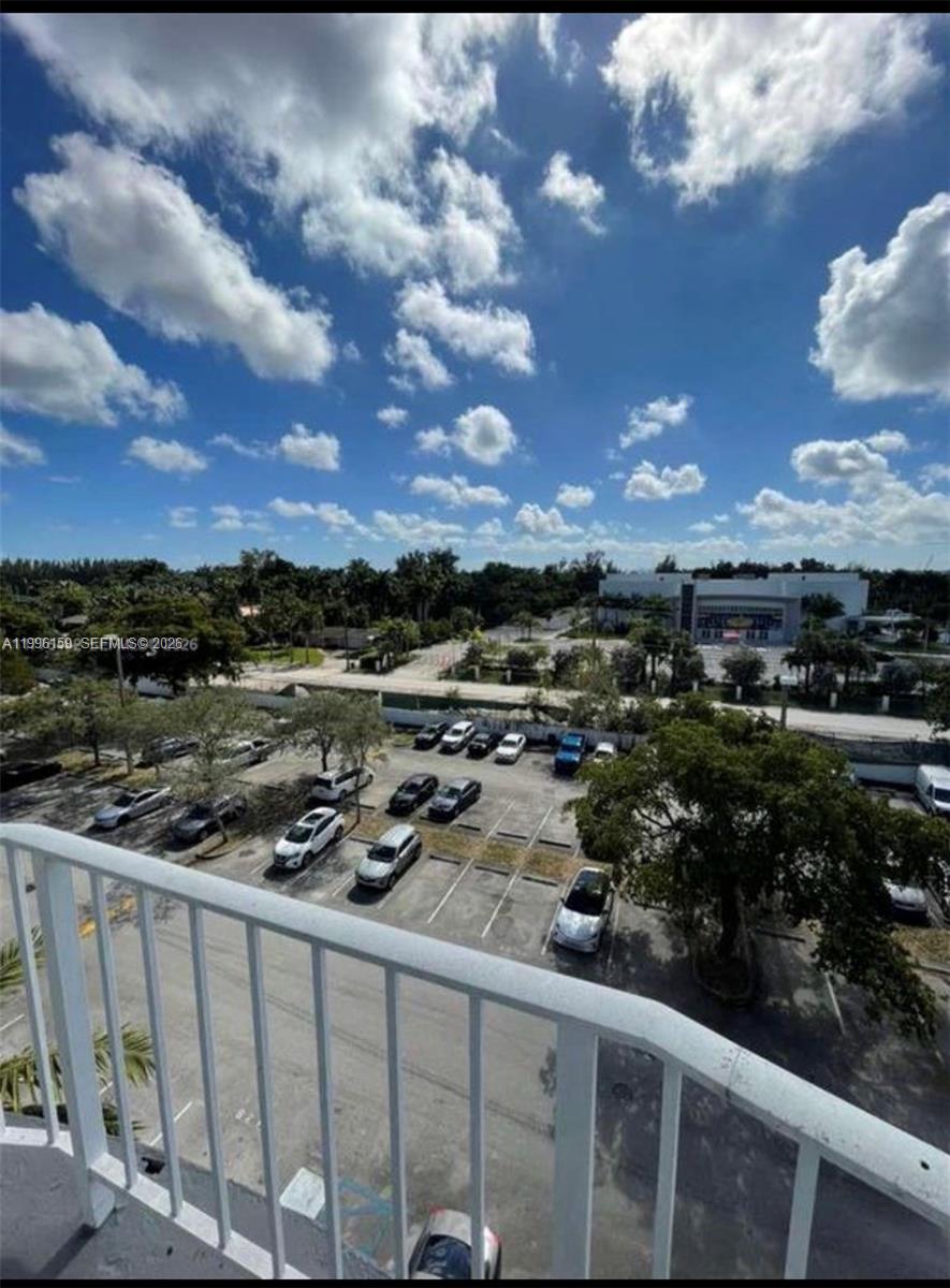 496 Northwest 165th Street, Unit D611 Miami, FL 33169 - Photo 7 of 8 a city view from a balcony