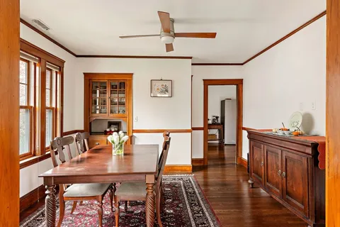 a view of a dining room with furniture and window