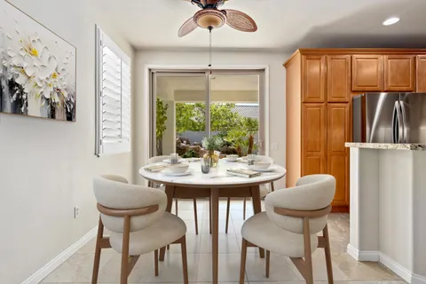 a view of a dining room with furniture window and outside view