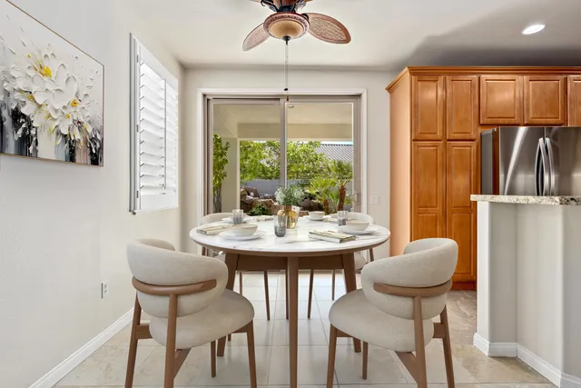 a view of a dining room with furniture window and outside view