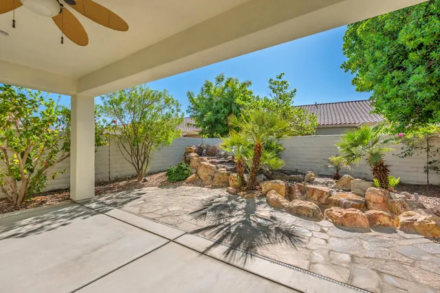 a view of a chairs and table in the patio