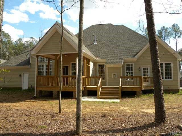 7208 Duncans Ridge Way Fuquay-Varina, NC 27526 - Photo 12 of 12 This is a view of the back of this house. Notice the Screened Porch, Deck and the pedestrian door on the left that leads into the oversized one car garage. Back Yard