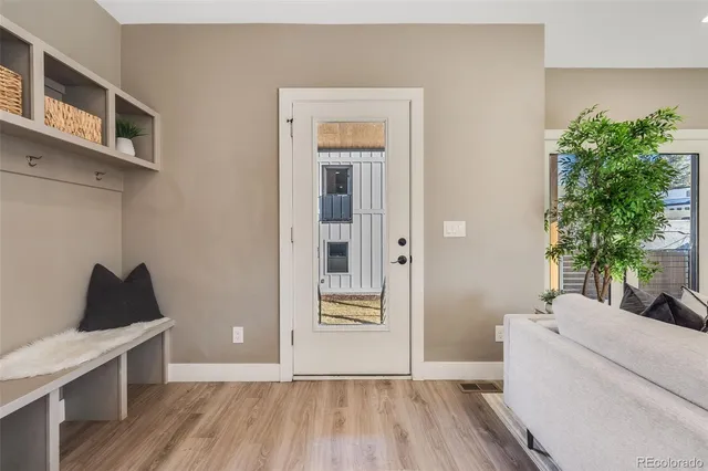 a view of a dining room with furniture window and wooden floor