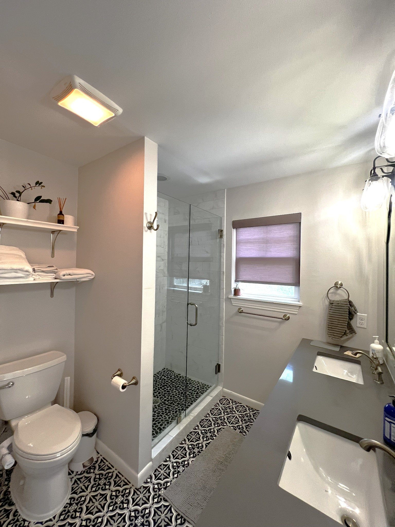 1311 Aggie Lane, Unit A Austin, TX 78757 - Photo 7 of 13 Primary Bathroom with dual vanities, walk in shower, and walk in closet. Separate access to the back patio