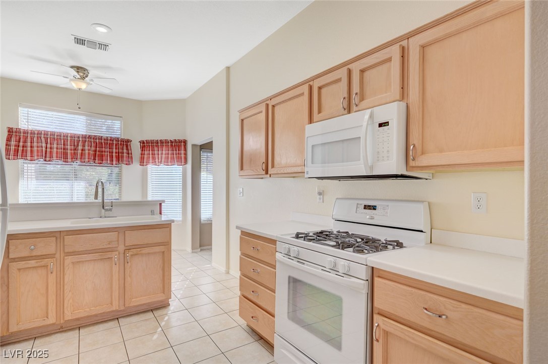9356 Villa Ridge Drive Las Vegas, NV 89134 - Photo 16 of 42 Solid countertops, moulded sink, gas range and oven