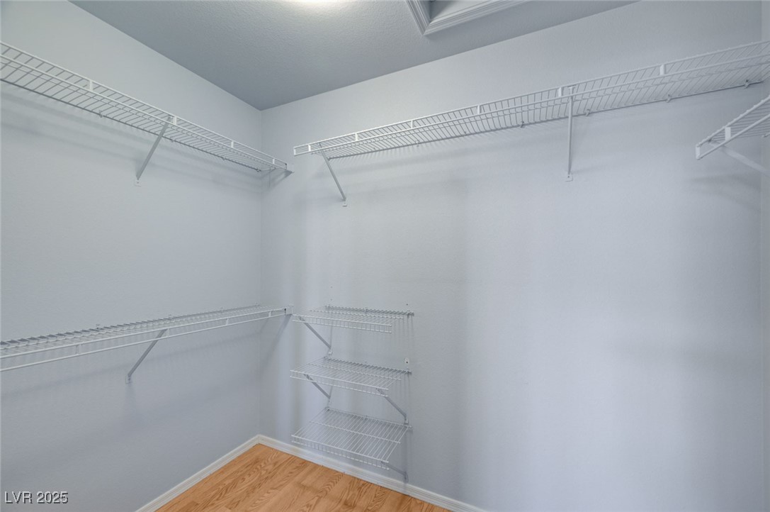 9356 Villa Ridge Drive Las Vegas, NV 89134 - Photo 26 of 42 Walk-in closet in primary bedroom
