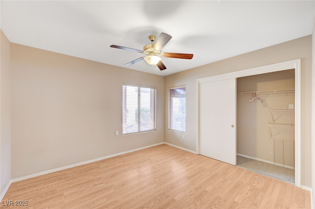 9356 Villa Ridge Drive Las Vegas, NV 89134 - Photo 29 of 42 Second bedroom with ceiling fan and light