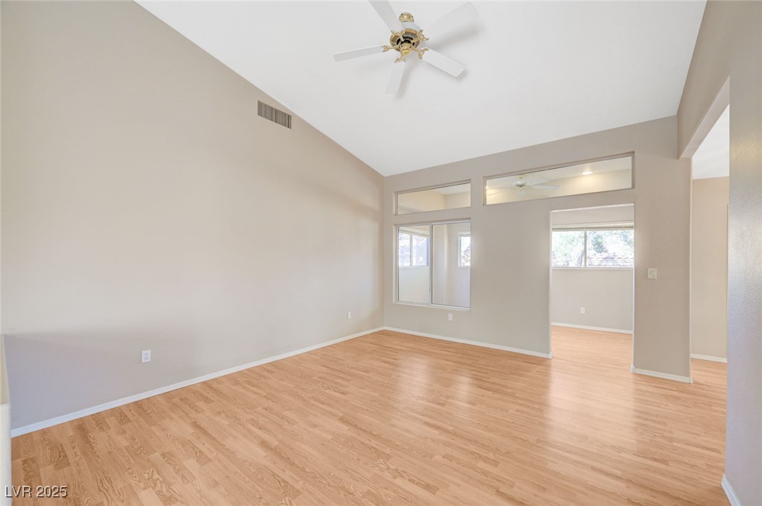 9356 Villa Ridge Drive Las Vegas, NV 89134 - Photo 6 of 42 Large living room with ceiling fan. Wood laminate flooring
