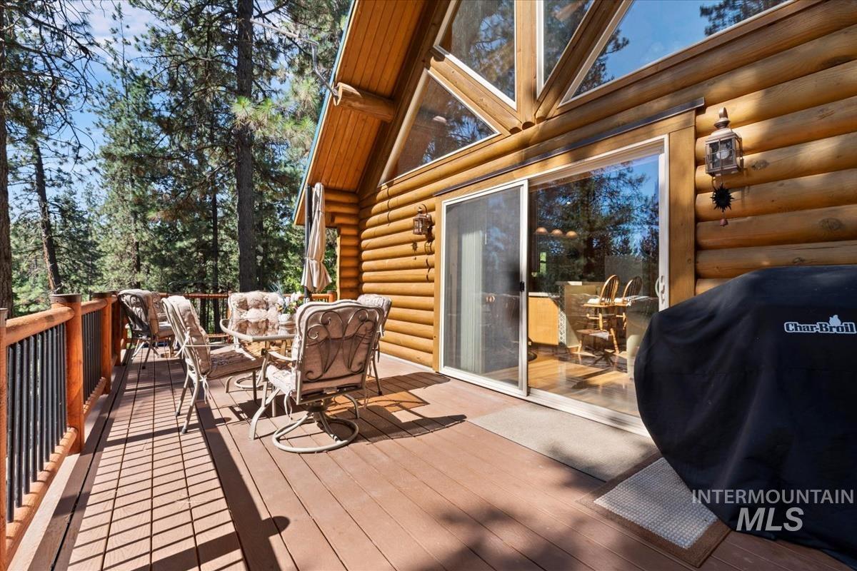 10 Elk Point Road Garden Valley, ID 83622 - Photo 34 of 42 Wooden terrace with a grill and outdoor dining area