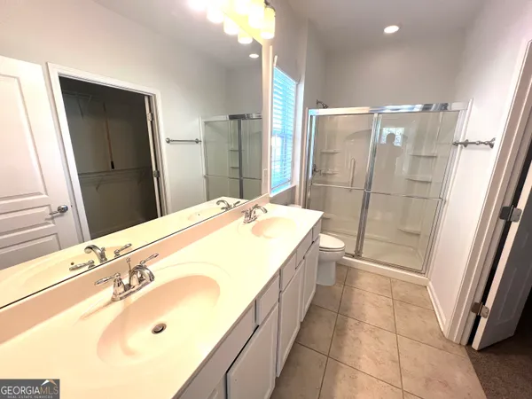 a bathroom with a tub sink and shower