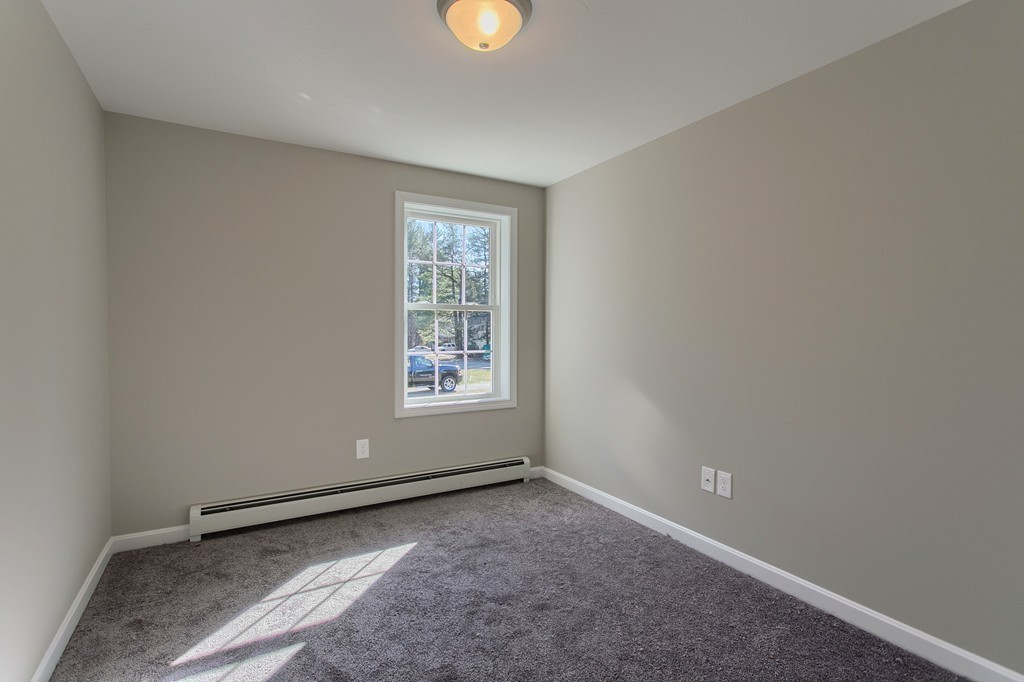 8 Shawnee Road, Unit B Pepperell, MA 01463 - Photo 9 of 18 an empty room with windows