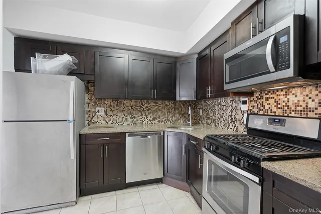 a kitchen with cabinets a washer and dryer
