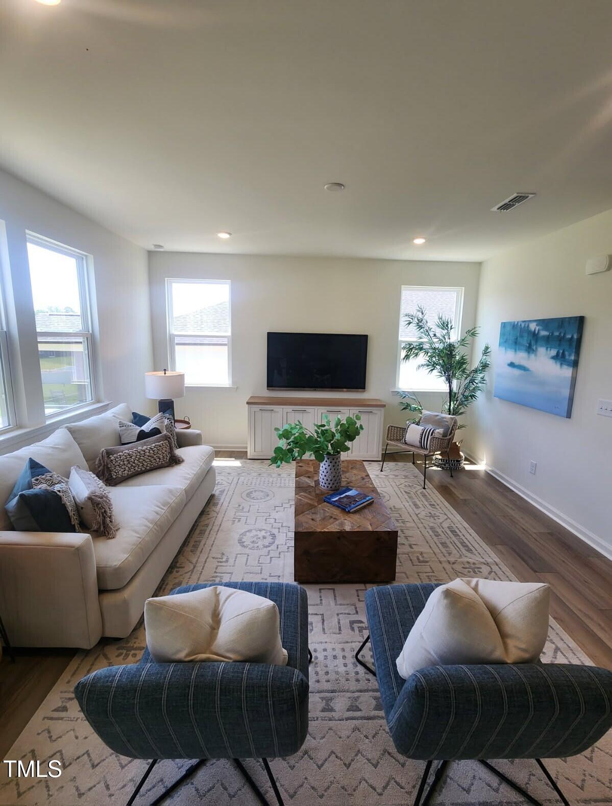 28 Longdale Drive Graham, NC 27253 - Photo 4 of 28 a living room with furniture and a flat screen tv