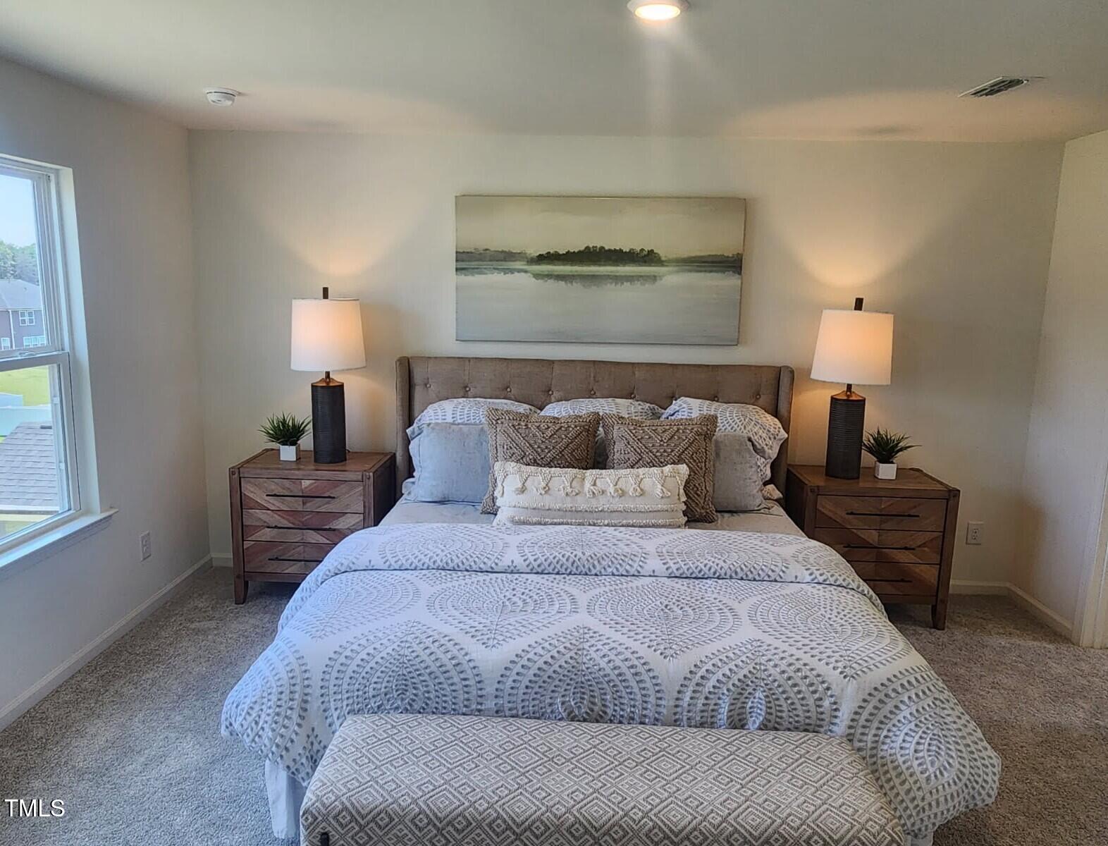 28 Longdale Drive Graham, NC 27253 - Photo 6 of 28 a bedroom with a bed and a lamp