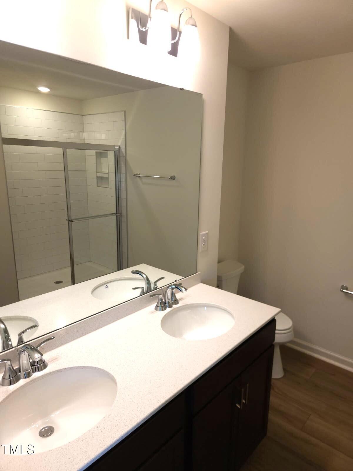 28 Longdale Drive Graham, NC 27253 - Photo 8 of 28 a bathroom with a sink a vanity and a mirror