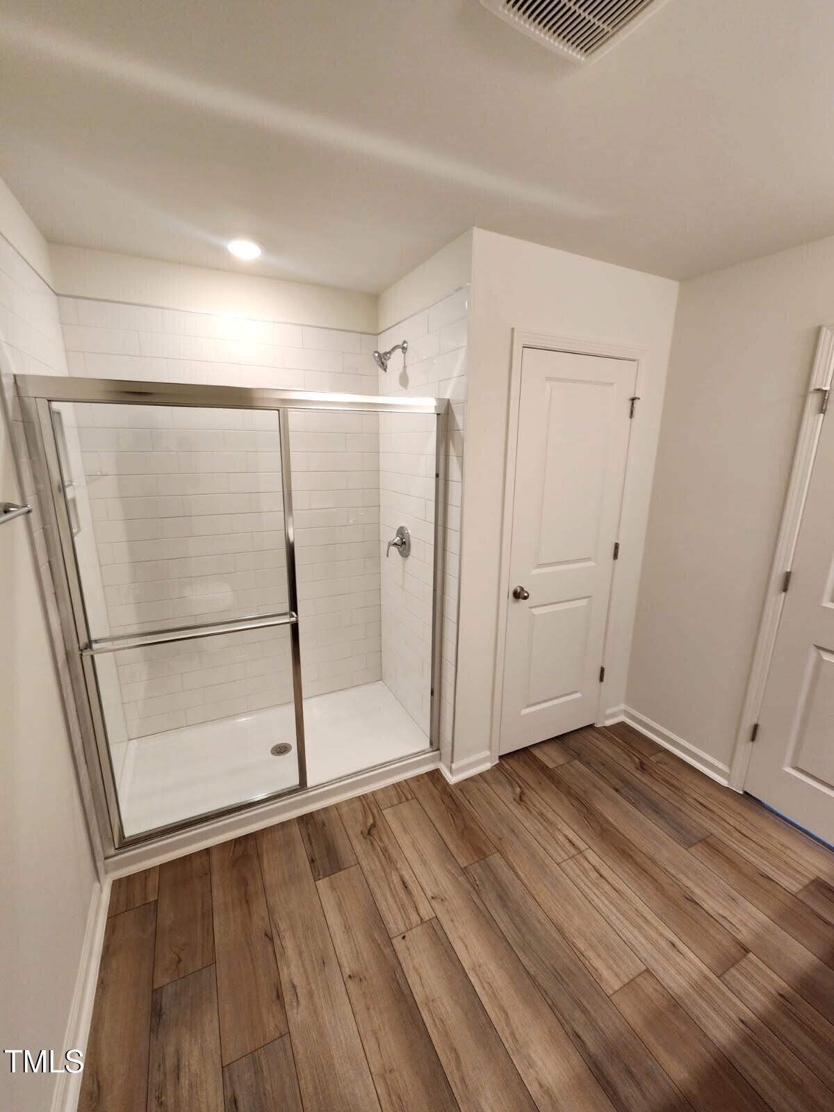 28 Longdale Drive Graham, NC 27253 - Photo 9 of 28 an empty room with wooden floor and white walls