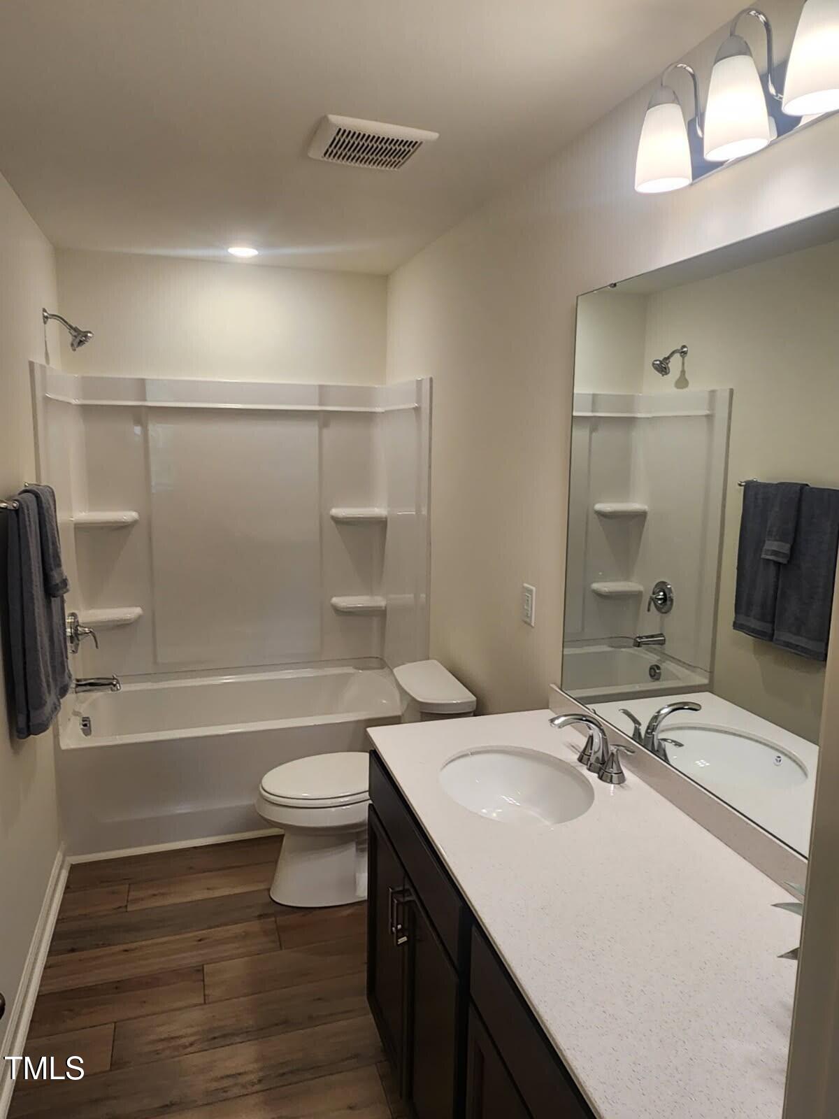 28 Longdale Drive Graham, NC 27253 - Photo 10 of 28 a bathroom with a sink a toilet and shower
