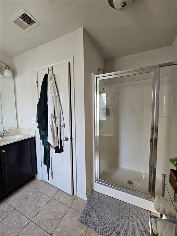 5747 Radford Loop Fairburn, GA 30213 - Photo 27 of 36 a bathroom with a shower and a glass door
