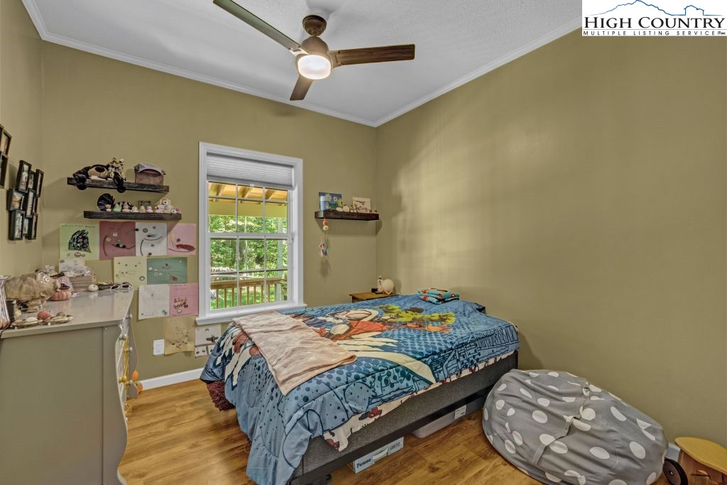 61 Snowbird Lane Linville, NC 28657 - Photo 11 of 19 a bedroom with a bed and a window