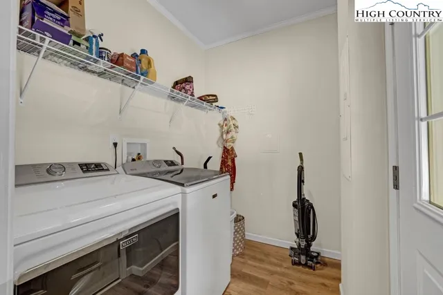 a view of storage and utility room with washer and dryer