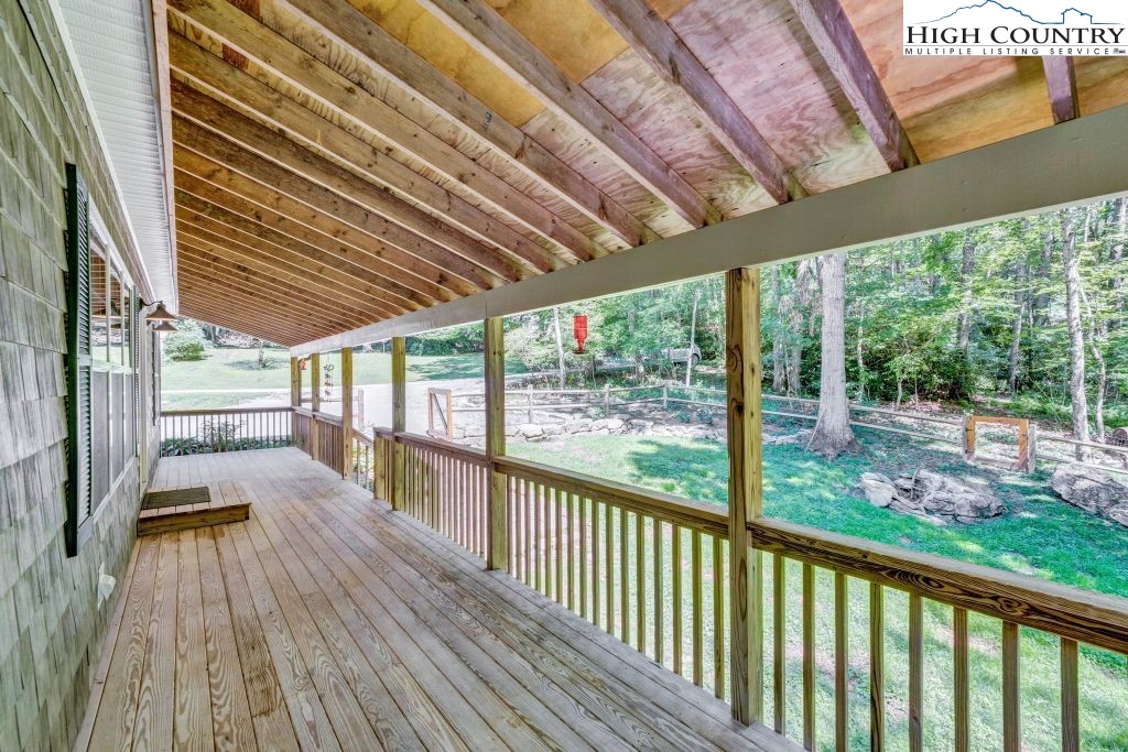 61 Snowbird Lane Linville, NC 28657 - Photo 13 of 19 a view of porch with wooden floor