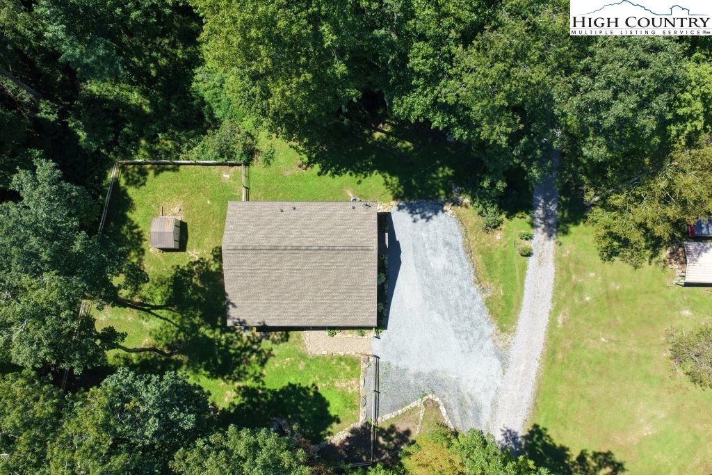 61 Snowbird Lane Linville, NC 28657 - Photo 16 of 19 an aerial view of a house with trees all around