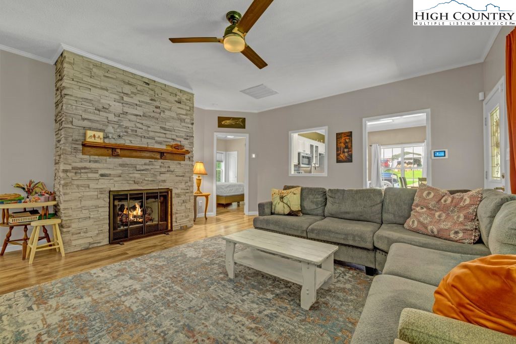 61 Snowbird Lane Linville, NC 28657 - Photo 3 of 19 a living room with furniture and a fireplace