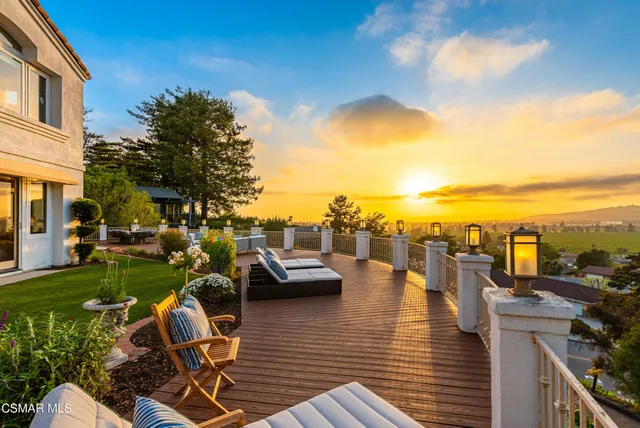 a view of a swimming pool and lounge chairs