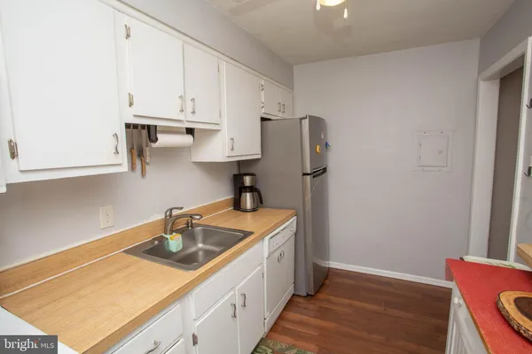 a very nice looking room with a large window and dresser