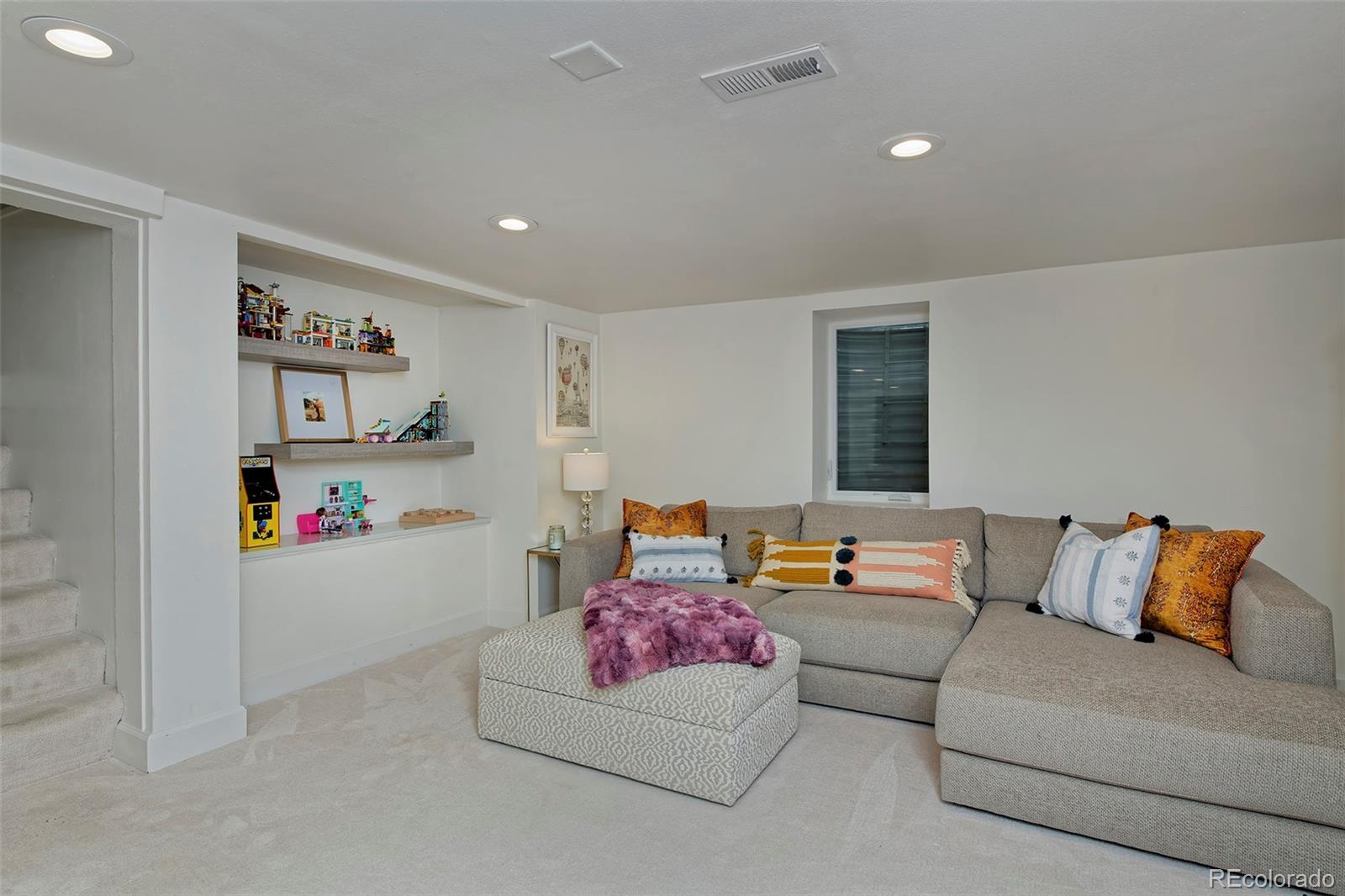 2591 Ash Street Denver, CO 80207 - Photo 35 of 48 a living room with furniture and a couch