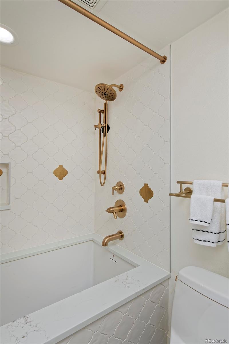 2591 Ash Street Denver, CO 80207 - Photo 39 of 48 a bathroom with a shower