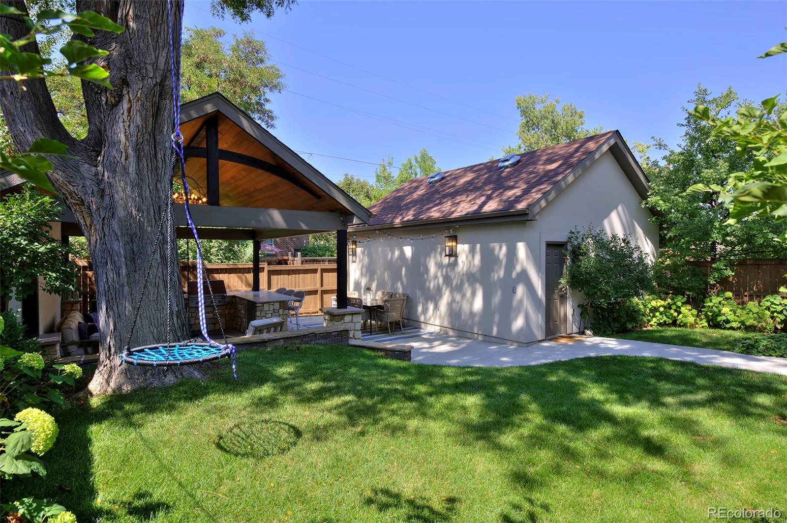 2591 Ash Street Denver, CO 80207 - Photo 46 of 48 a view of a house with backyard and sitting area