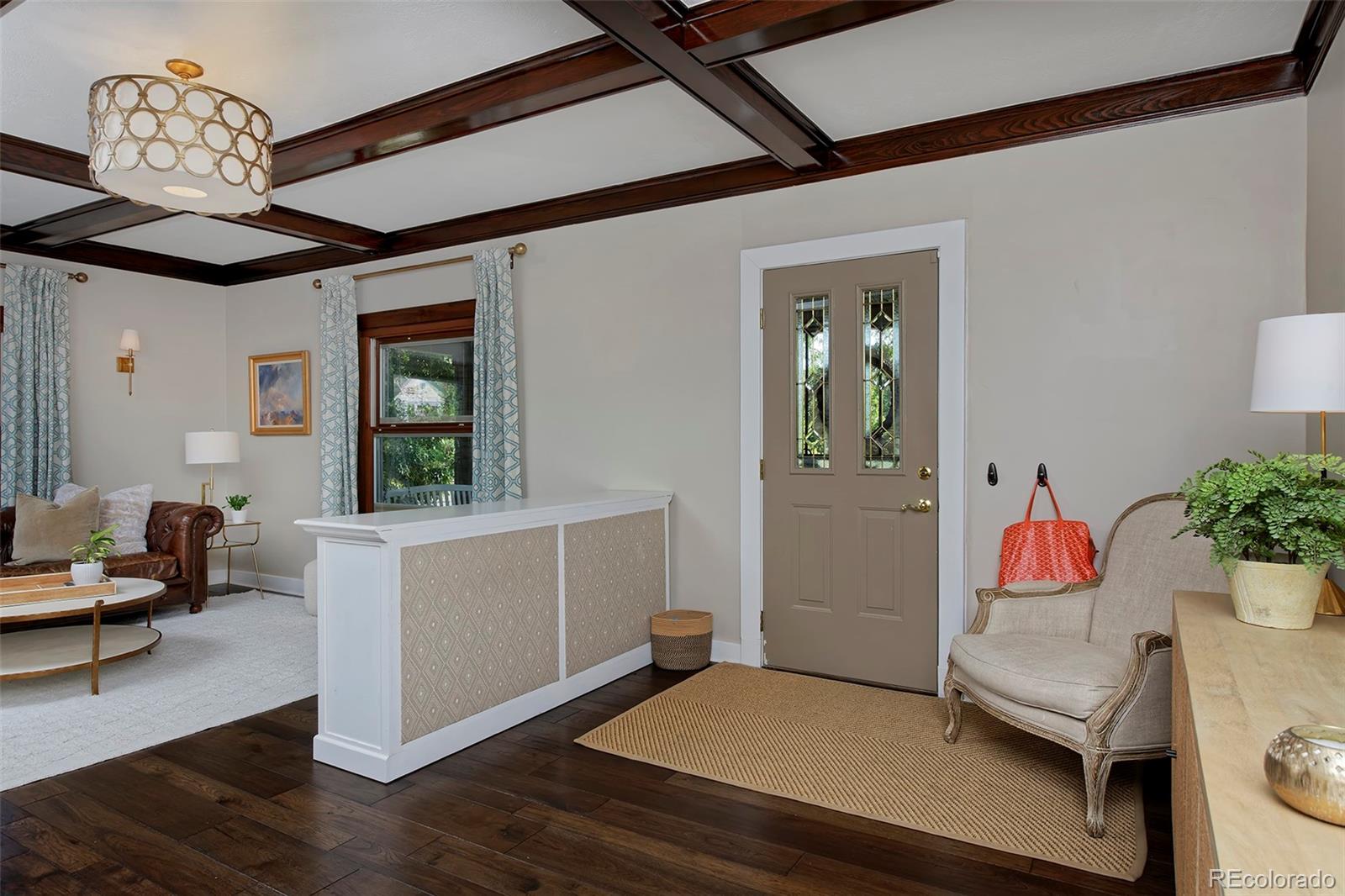 2591 Ash Street Denver, CO 80207 - Photo 5 of 48 a living room with a couch