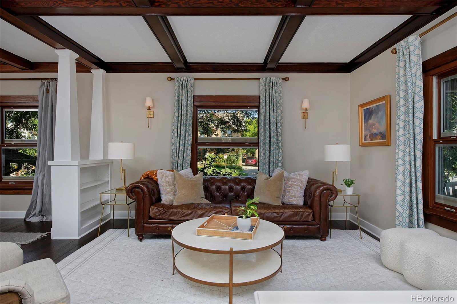 2591 Ash Street Denver, CO 80207 - Photo 7 of 48 a living room with furniture and a large window